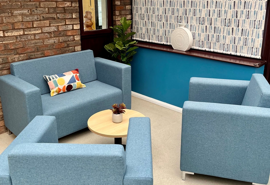Blue chairs in the lounge at the Chicksands Centre